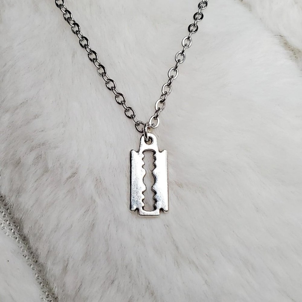 Tiny razor blade necklace.